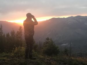 Guided elk and deer hunt in Montana glassing the canyon